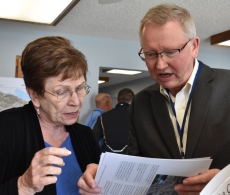 State Rep. Alice Hausman and Lake City Mayor Mark Nichols discuss a list of city potential and in-progress city projects during a visit to the city by members of the state House’s capital investment committee.
